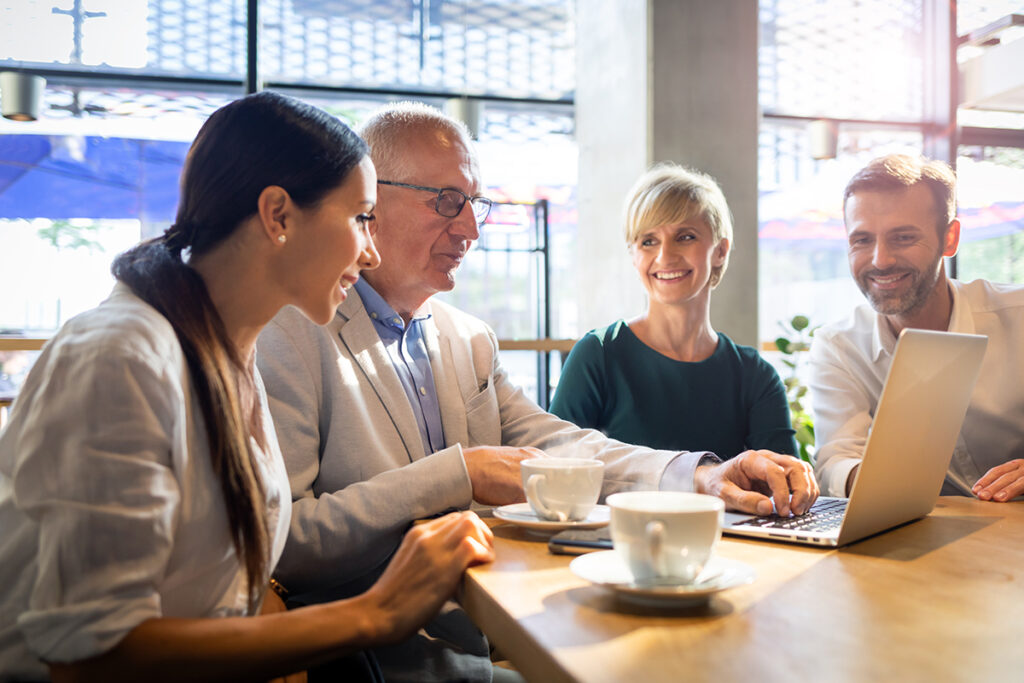 Family business team reviewing plans together - Waypoint Family Business Advisory