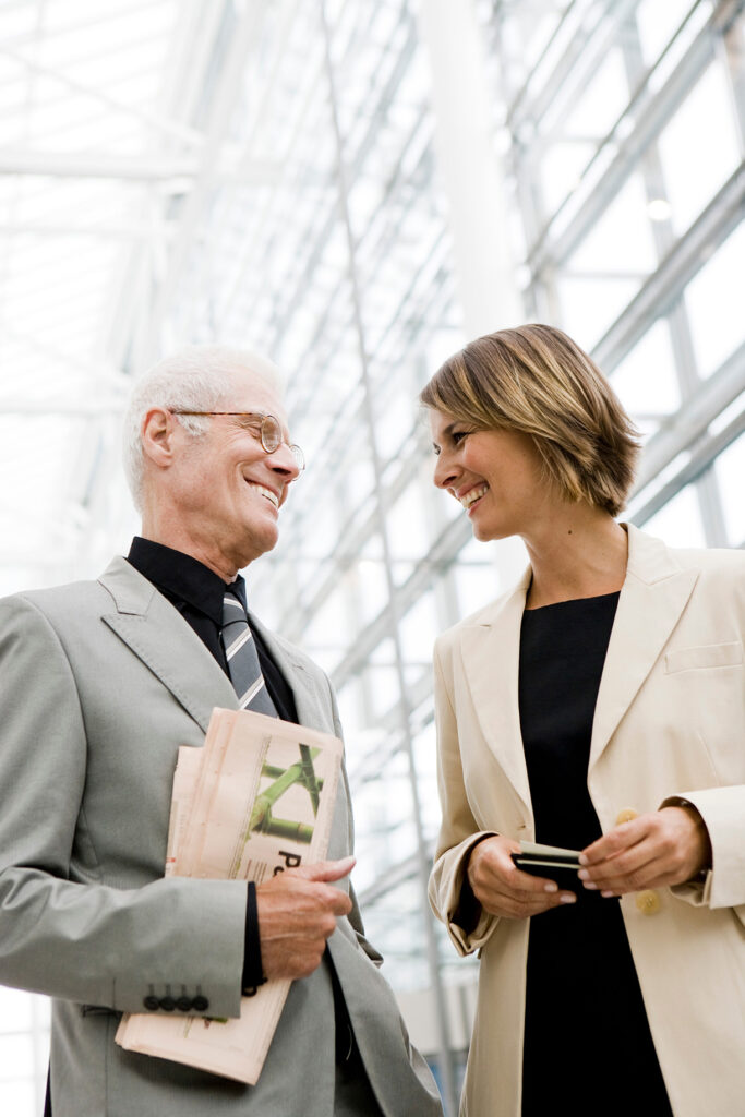 Senior business owner and next-generation leader in conversation - Waypoint Family Business Advisory